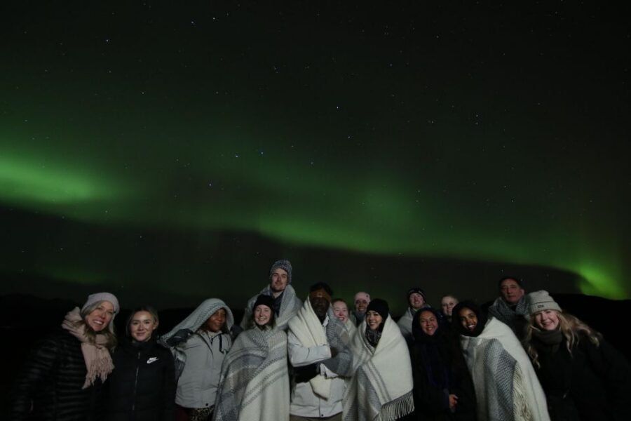 From Reykjavik: Northern Lights Tour with Hot Cocoa & Photos - Staying Warm: Wool Blankets, Cocoa, and Icelandic Donuts