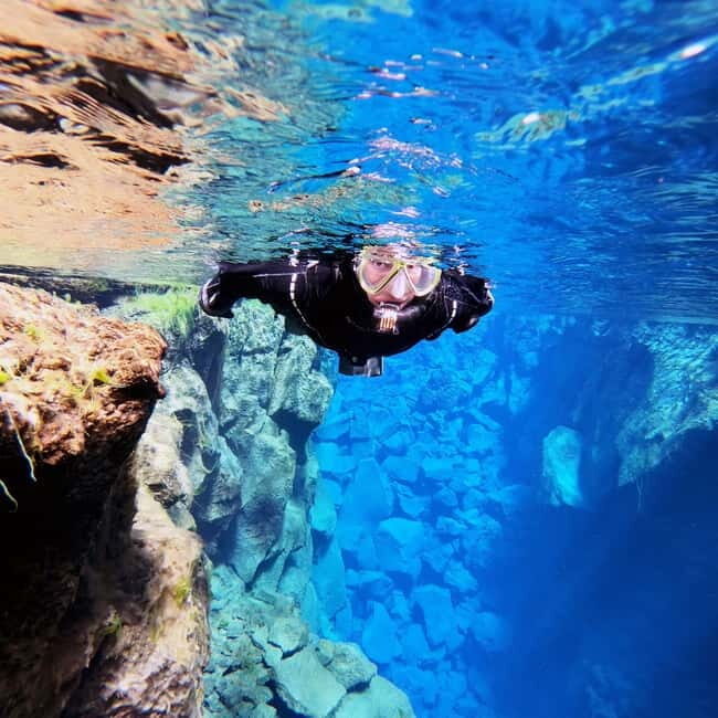 From Reykjavik: Silfra Snorkeling with Free Photos - Your Gear Choice: Drysuit vs Wetsuit (And What It Changes)