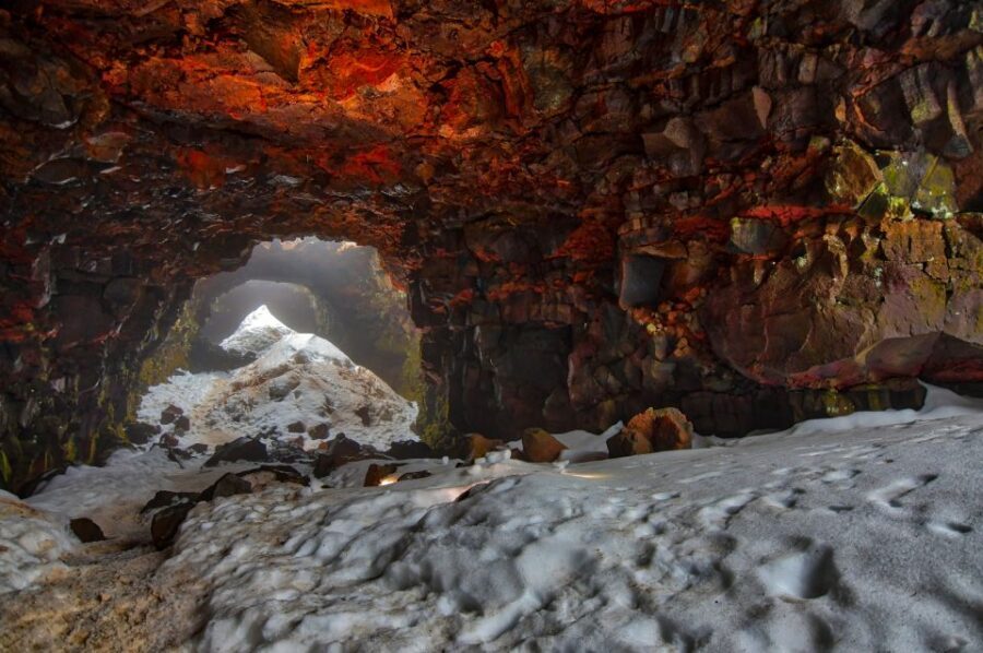 Raufarhólshellir Lava Tunnel: Underground Expedition - Entering the tunnel: rough ground, footbridges, and volcanic textures