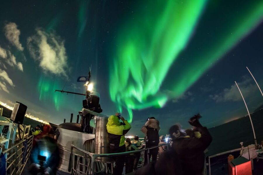 Reykjavik: Northern Lights Guided Boat Tour - Old Harbour boarding and the quick move away from city glow