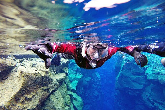 Silfra Drysuit Snorkeling Tour with Free Photos - From Reykjavik - Before you enter the fissure: safety briefing, photos, and hot chocolate
