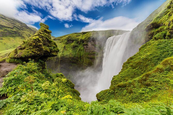 South Coast Iceland from Reykjavik with Guide & Touchscreen Audio - Skógafoss: two viewpoints, one staircase, and a big reason this stop matters